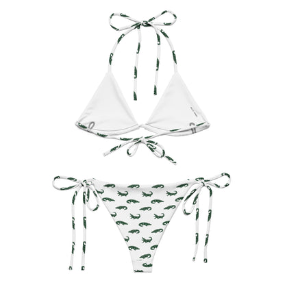 White bikini with pattern of green alligators.