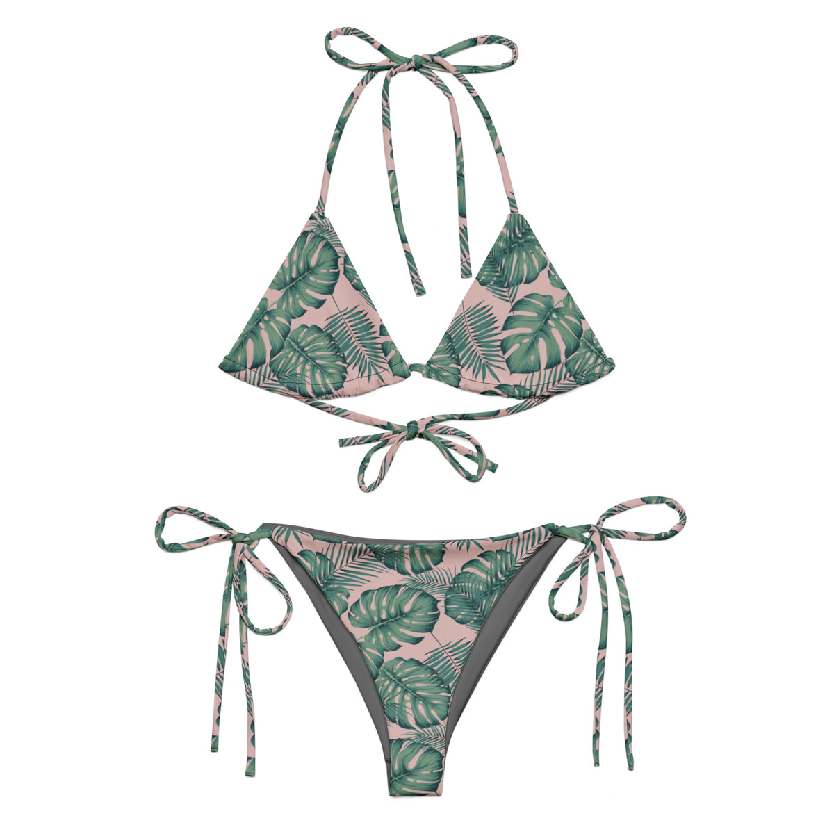 Bikini with pattern of green palm leaves set on a pink background.