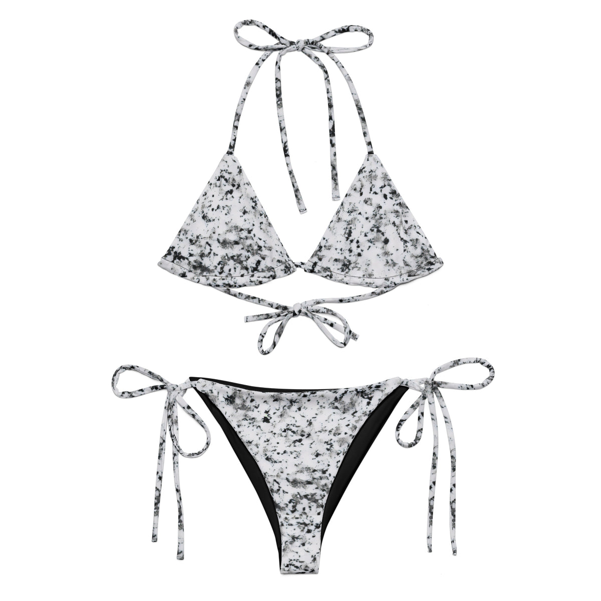 Bikini with design of black splotches on a white background.