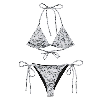 Bikini with design of black splotches on a white background.