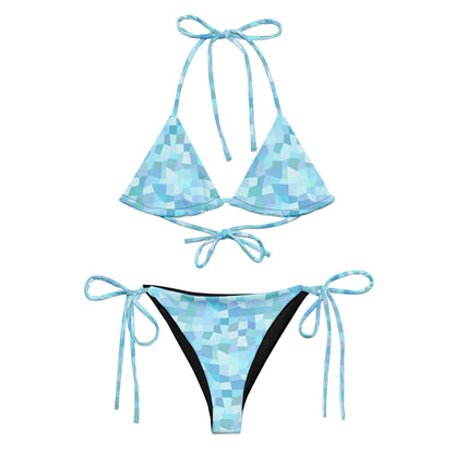 Bikini with cyan geometric pattern.