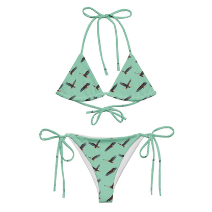Green bikini with pattern of bald eagles.