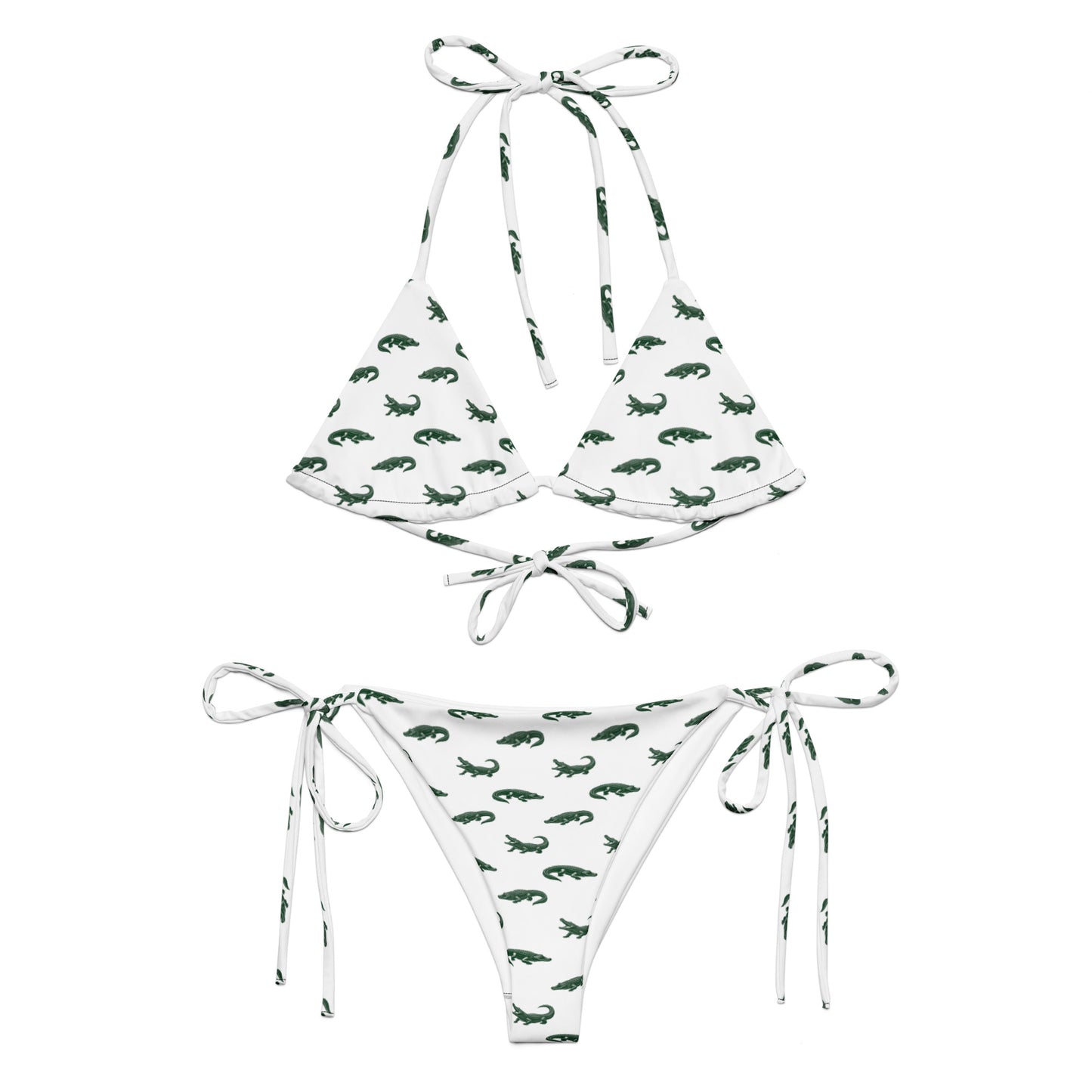 White bikini with pattern of green alligators.