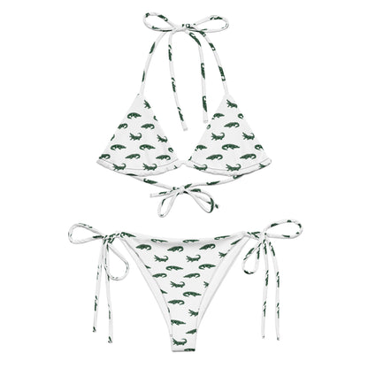 White bikini with pattern of green alligators.