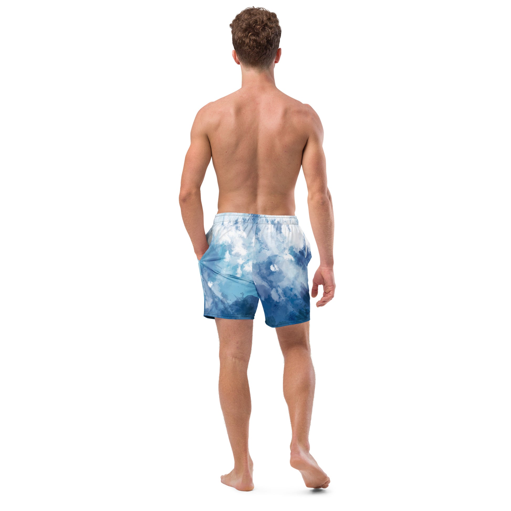 Rear view of man wearing swim trunks with a blue-white watercolor pattern.