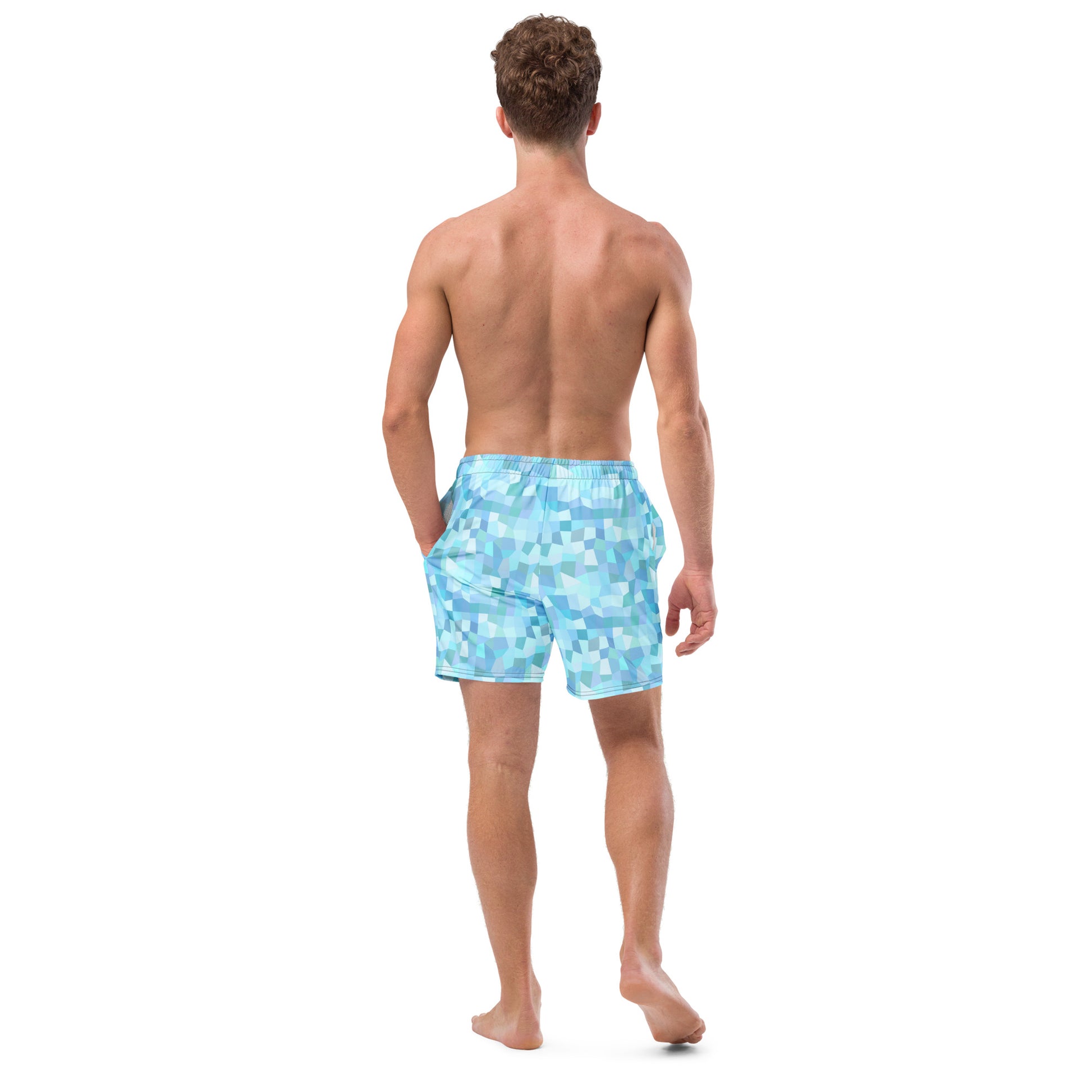 Rear view of man wearing swim trunks with light-blue geometric pattern.