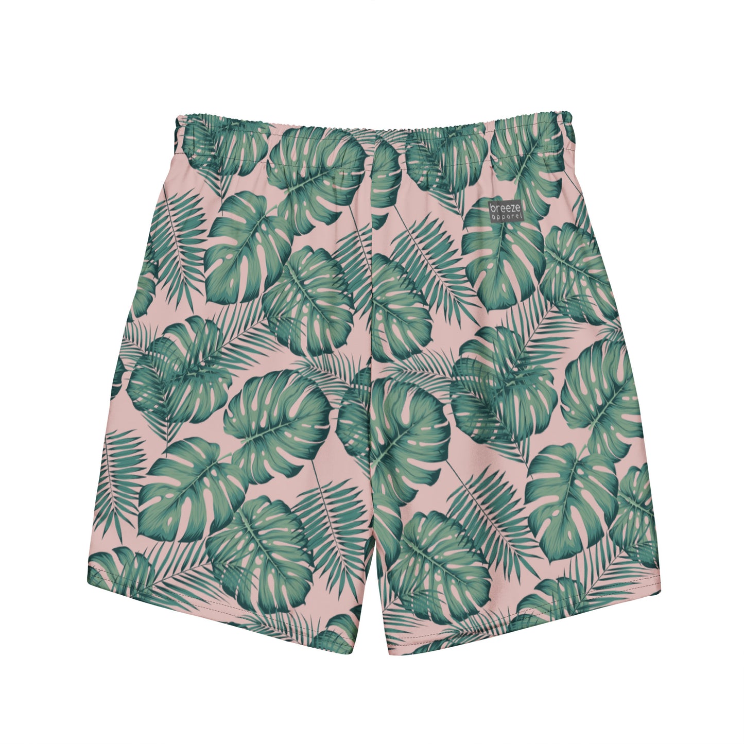 Back of swim trunks with pattern of green palm leaves set on a pink background.