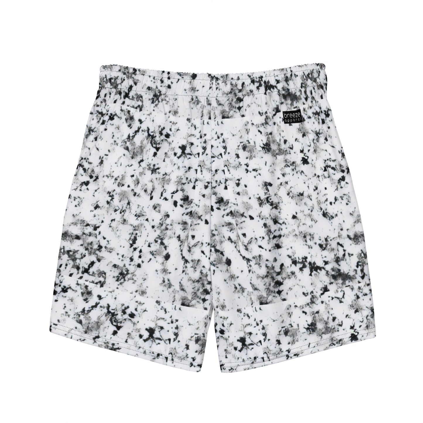 Back of swim trunks with pattern of black splotches on a white background.