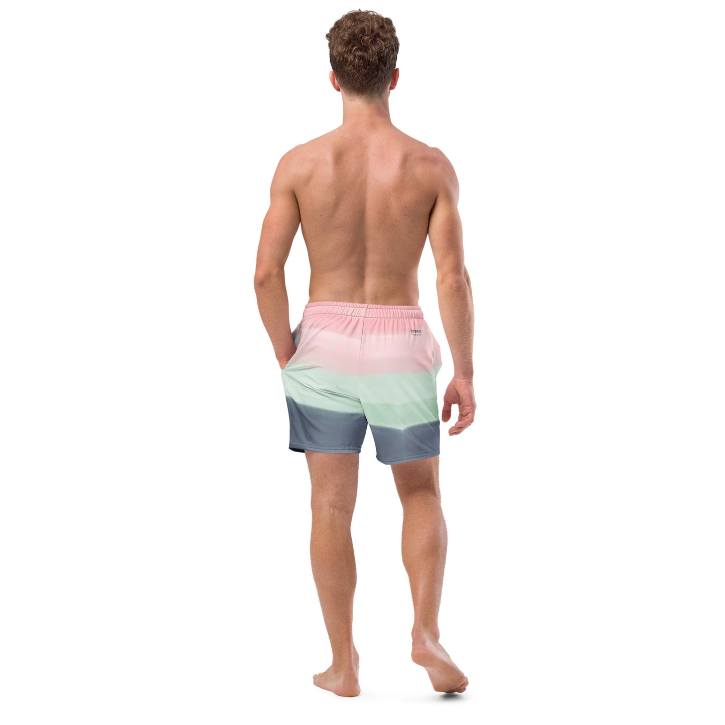 Rear view of man wearing swim trunks with color scheme of pink, light green, and gray, resembling watercolor.