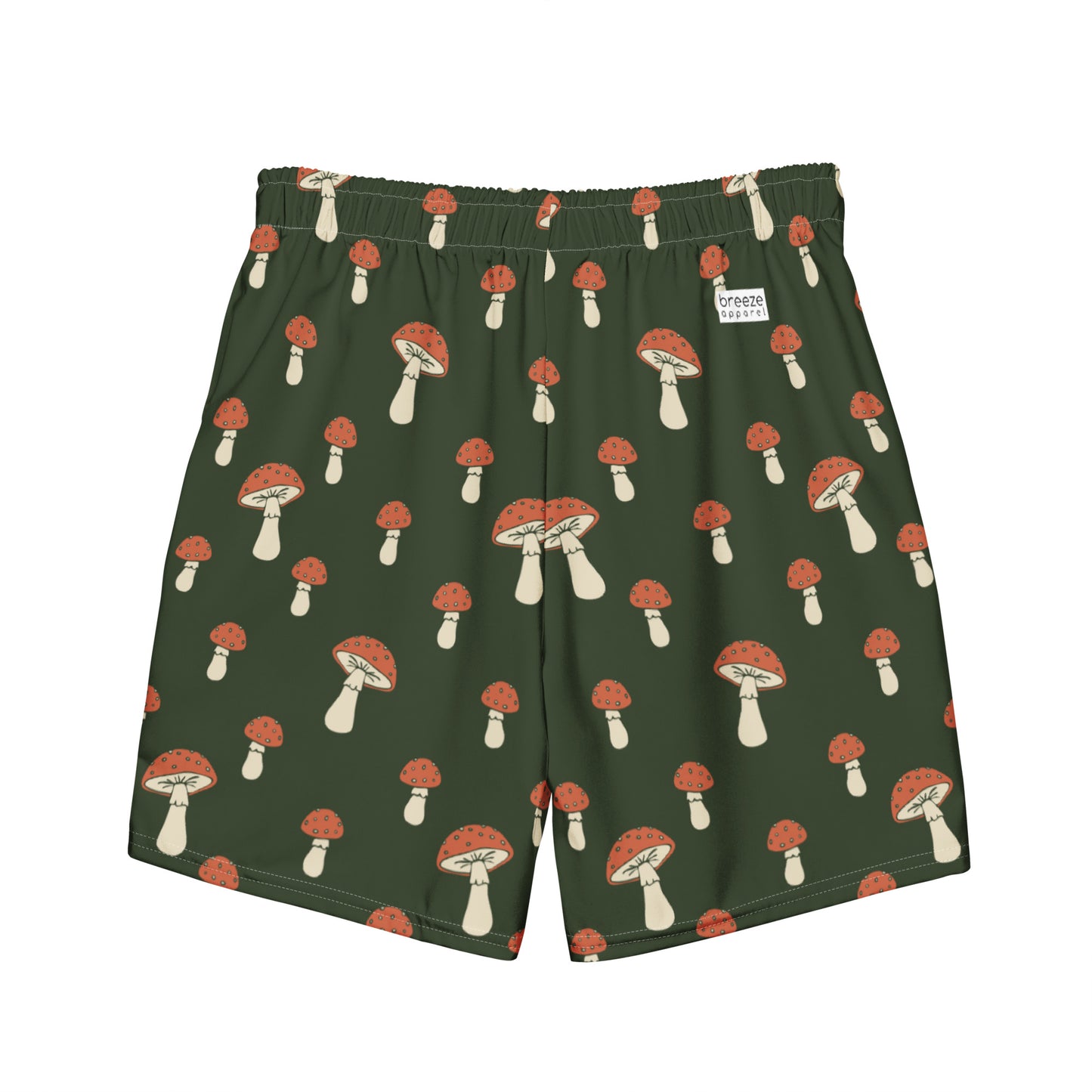 Swim trunks with pattern of mushrooms on a green background.