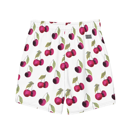 Swim trunks with pattern of cherries set on a white background.