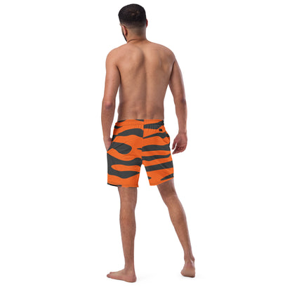 Rear view of man wearing swim trunks with tiger-skin pattern.