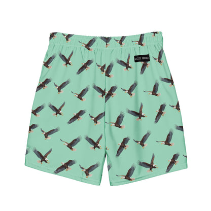 Green swim trunks with pattern of bald eagles.