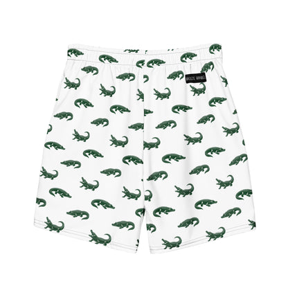 White swim trunks with pattern of green alligators.