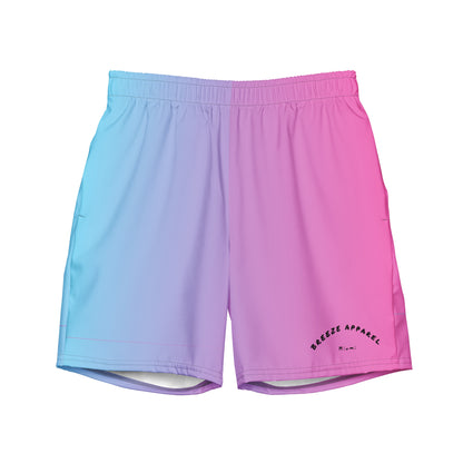 Men's swim trunks with a light-blue-to-pink design and a black 'Breeze Apparel Miami' word logo on the bottom-left knee
