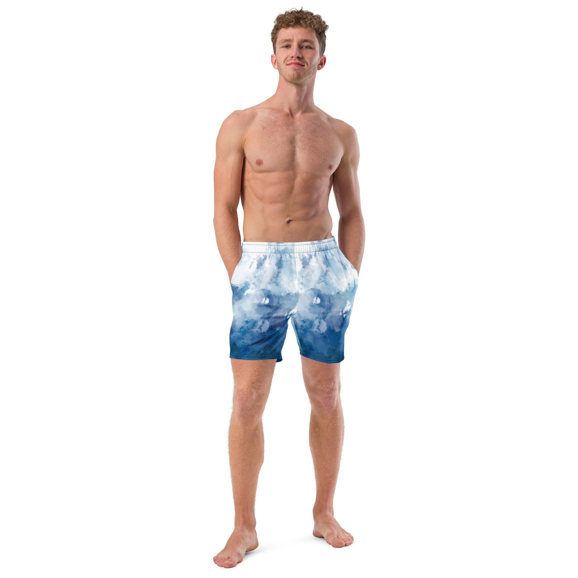 Man wearing swim trunks with a blue-white watercolor pattern.