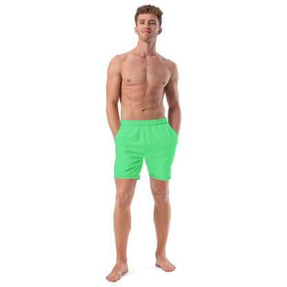 Man wearing mint-green swim trunks.