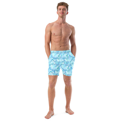 Man wearing swim trunks with light-blue geometric pattern.
