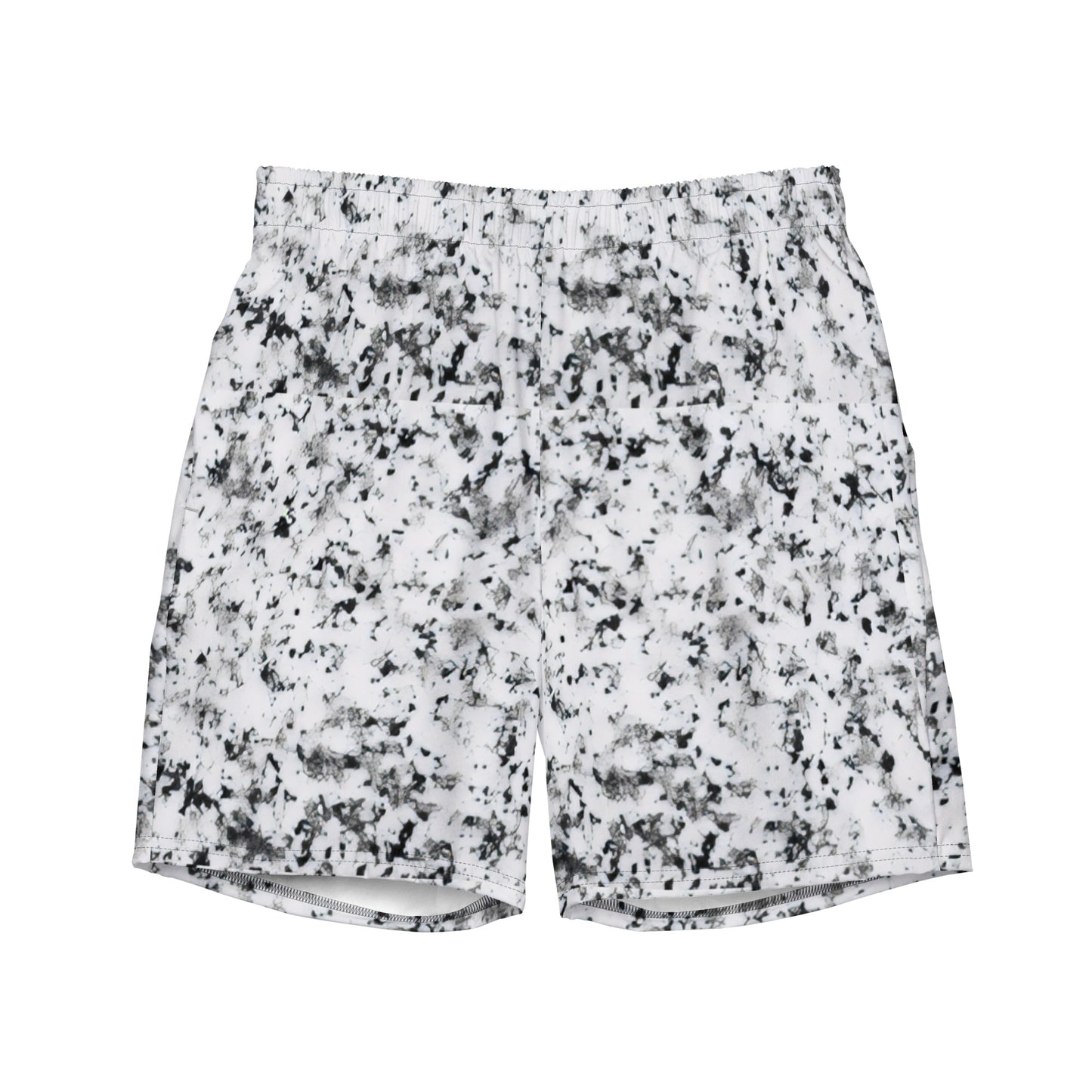 Swim trunks with pattern of black splotches on a white background.