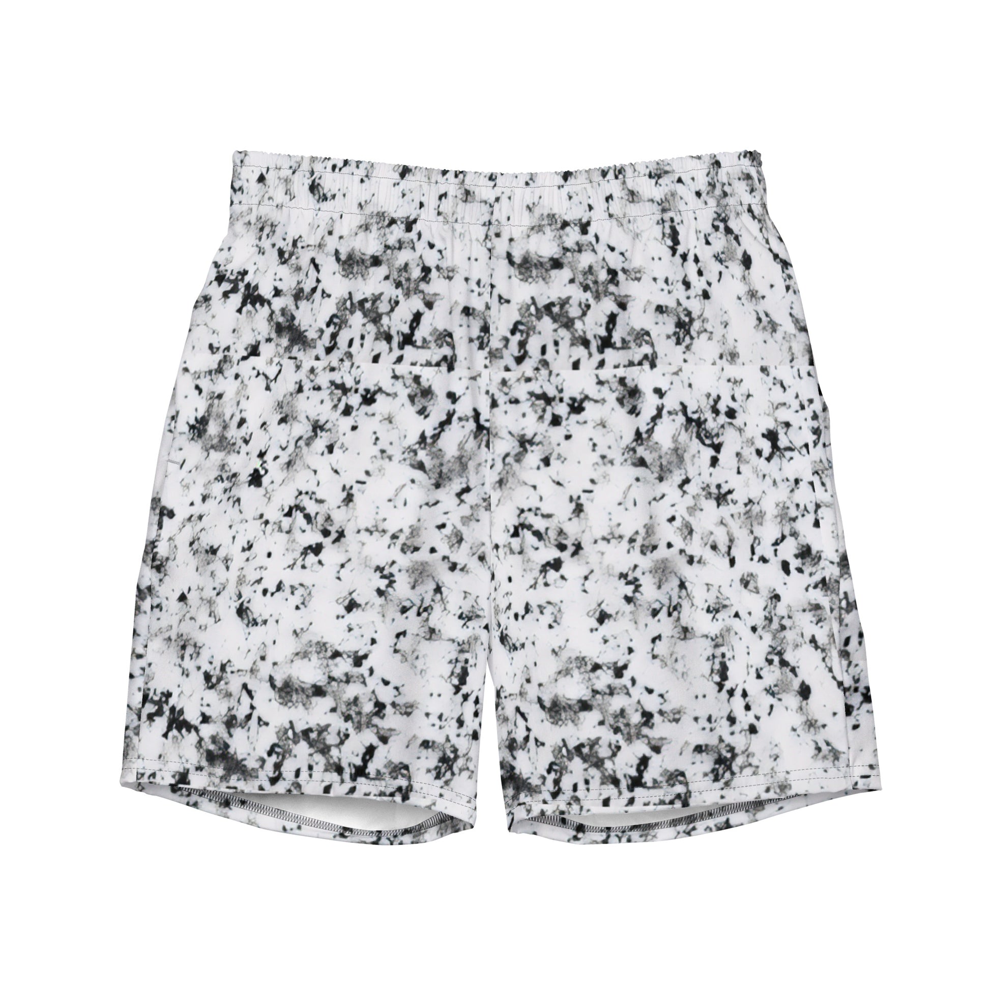 Swim trunks with pattern of black splotches on a white background.