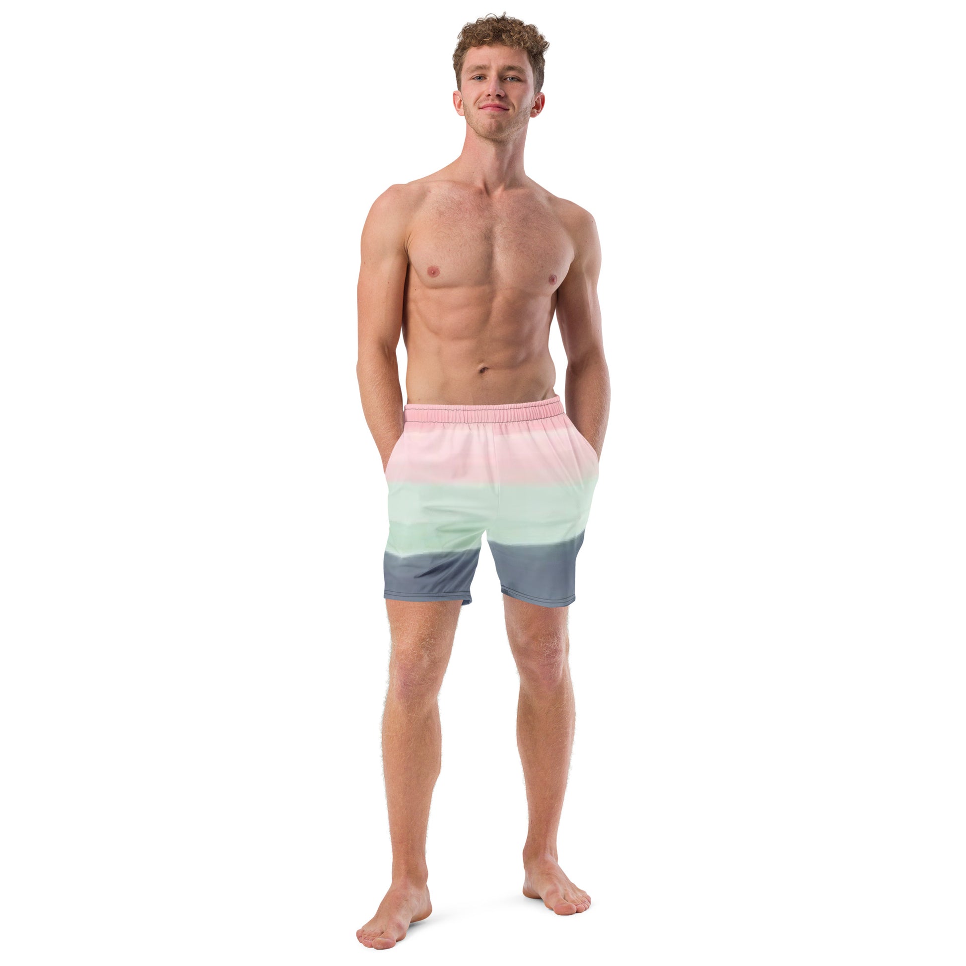 Man wearing swim trunks with color scheme of pink, light green, and gray, resembling watercolor.