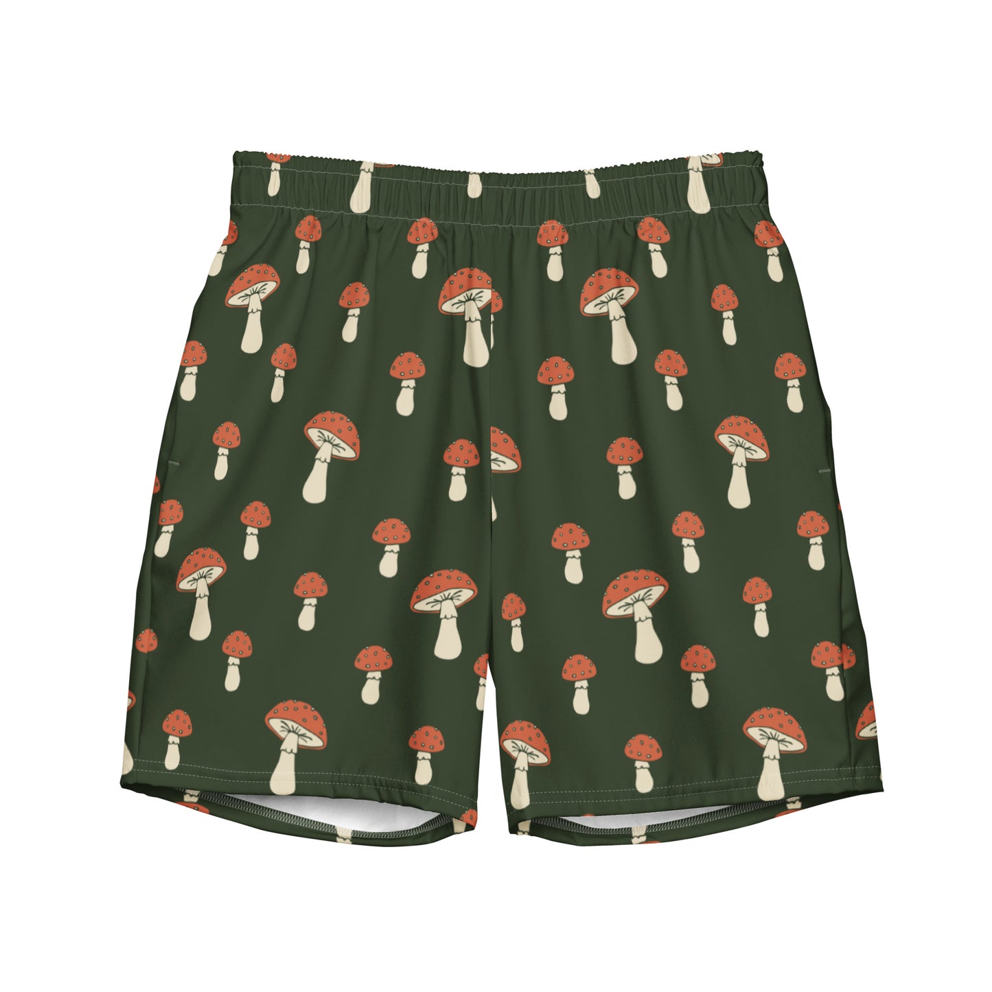 Swim trunks with pattern of mushrooms on a green background.