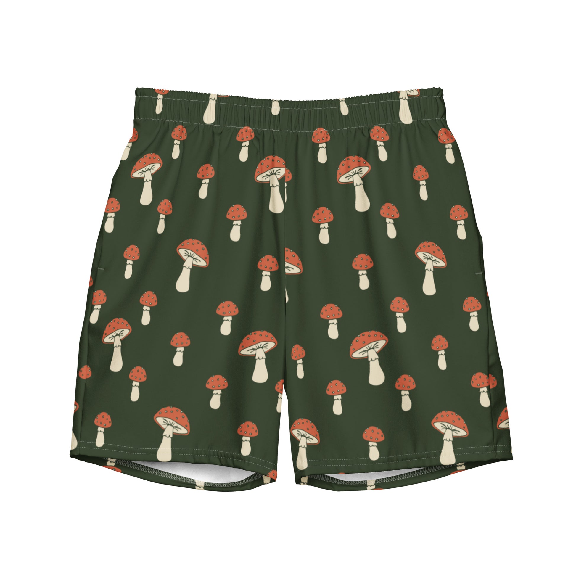 Swim trunks with pattern of mushrooms on a green background.