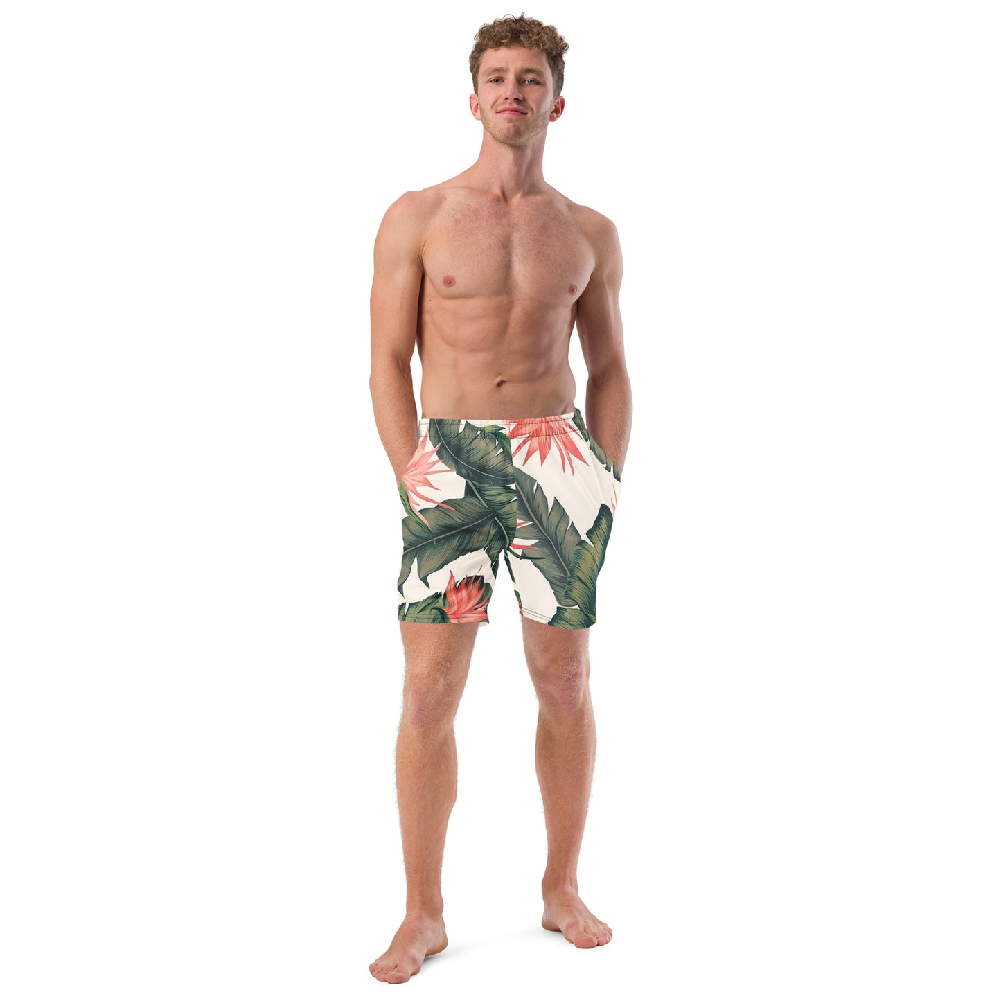 Man wearing swim trunks with tropical floral pattern.