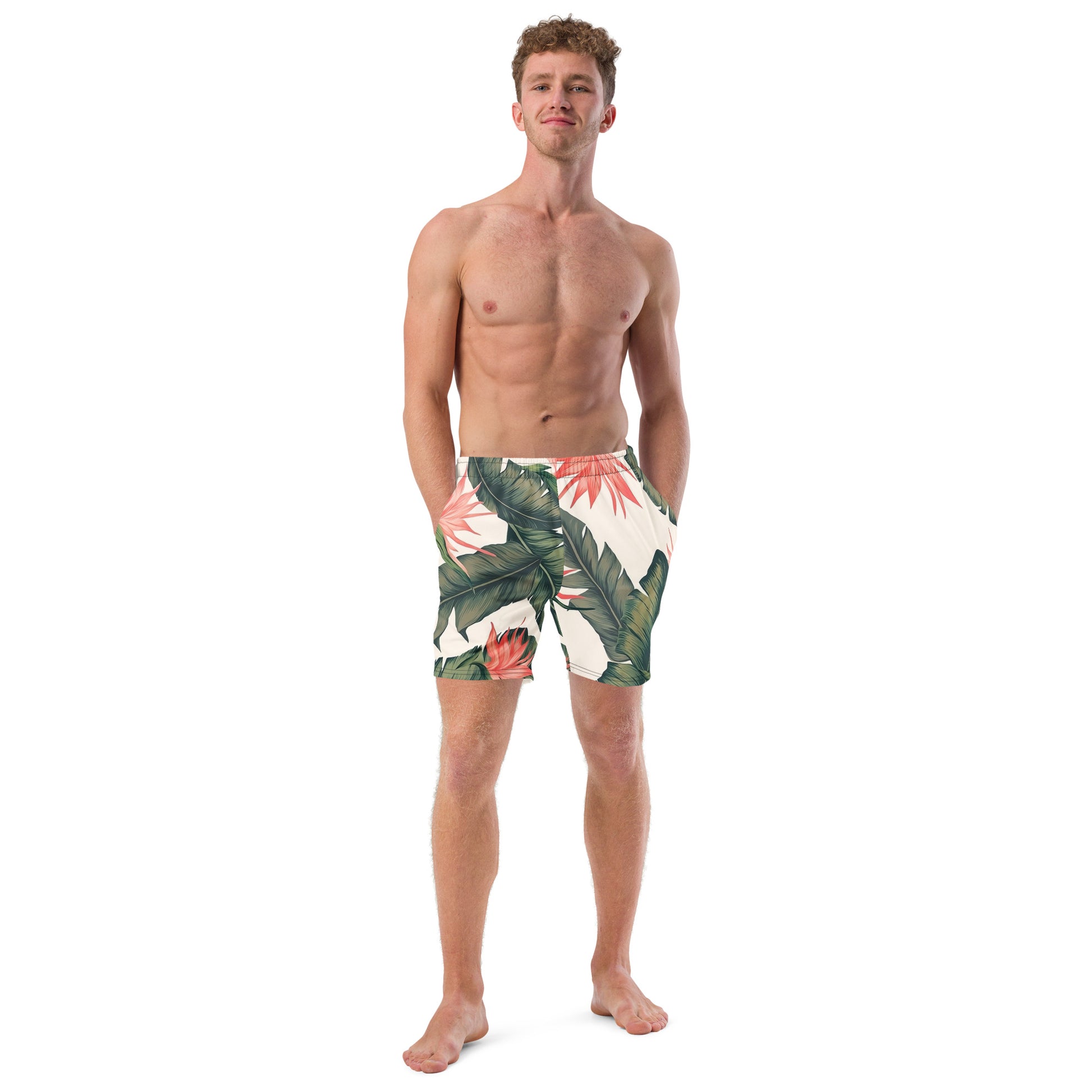 Man wearing swim trunks with tropical floral pattern.