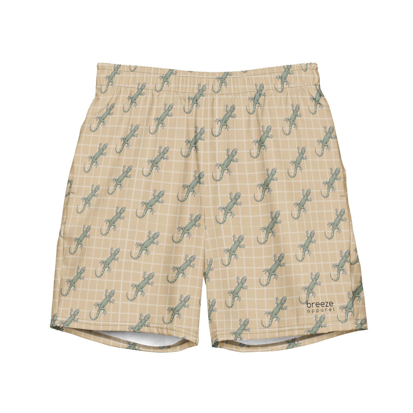 Beige swim trunks with pattern of green lizards.