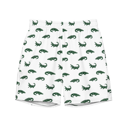 White swim trunks with pattern of green alligators.