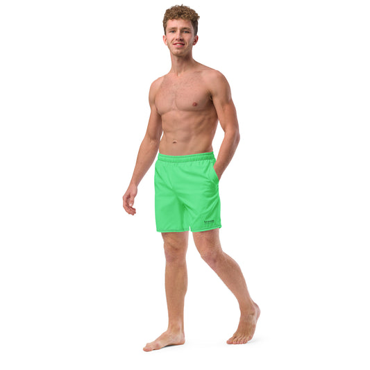 Man wearing mint-green swim trunks.