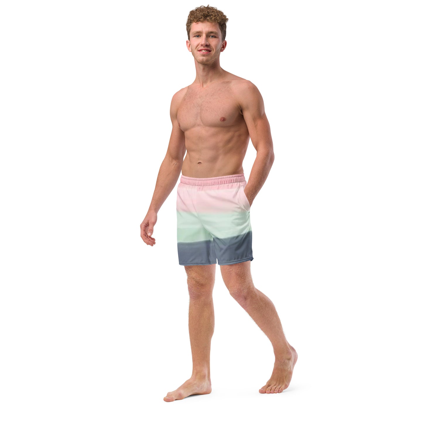 Man wearing swim trunks with color scheme of pink, light green, and gray, resembling watercolor.