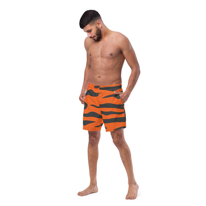 Man wearing swim trunks with tiger-skin pattern.