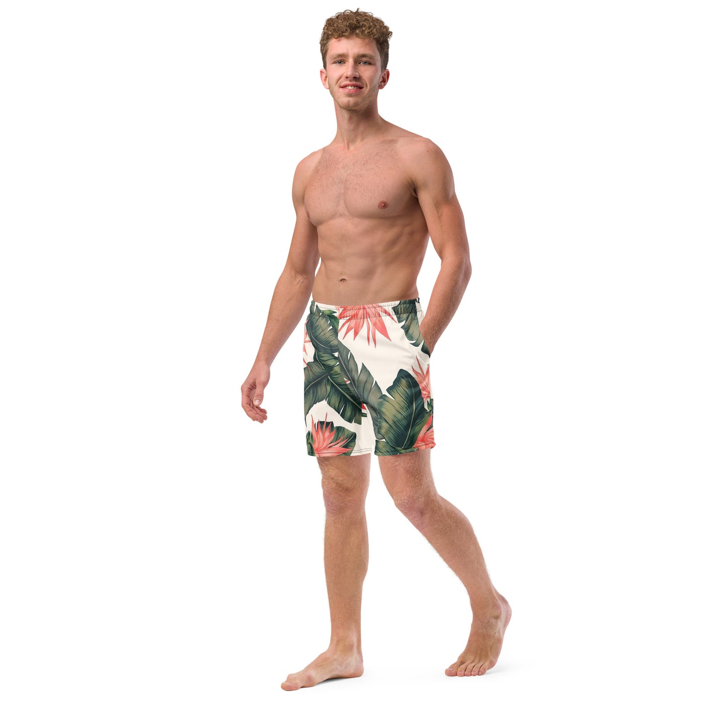 Man wearing swim trunks with tropical floral pattern.