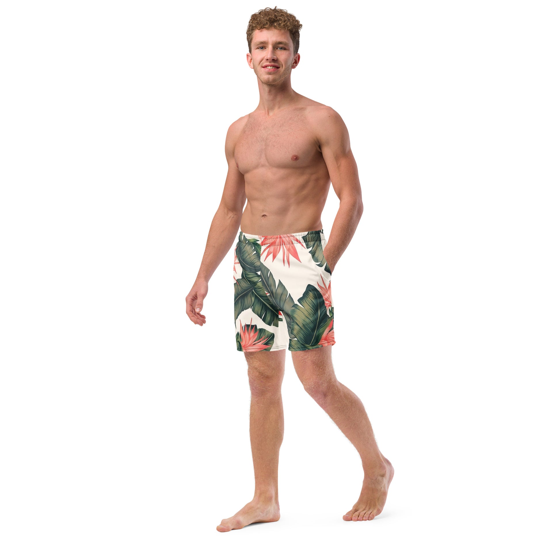 Man wearing swim trunks with tropical floral pattern.