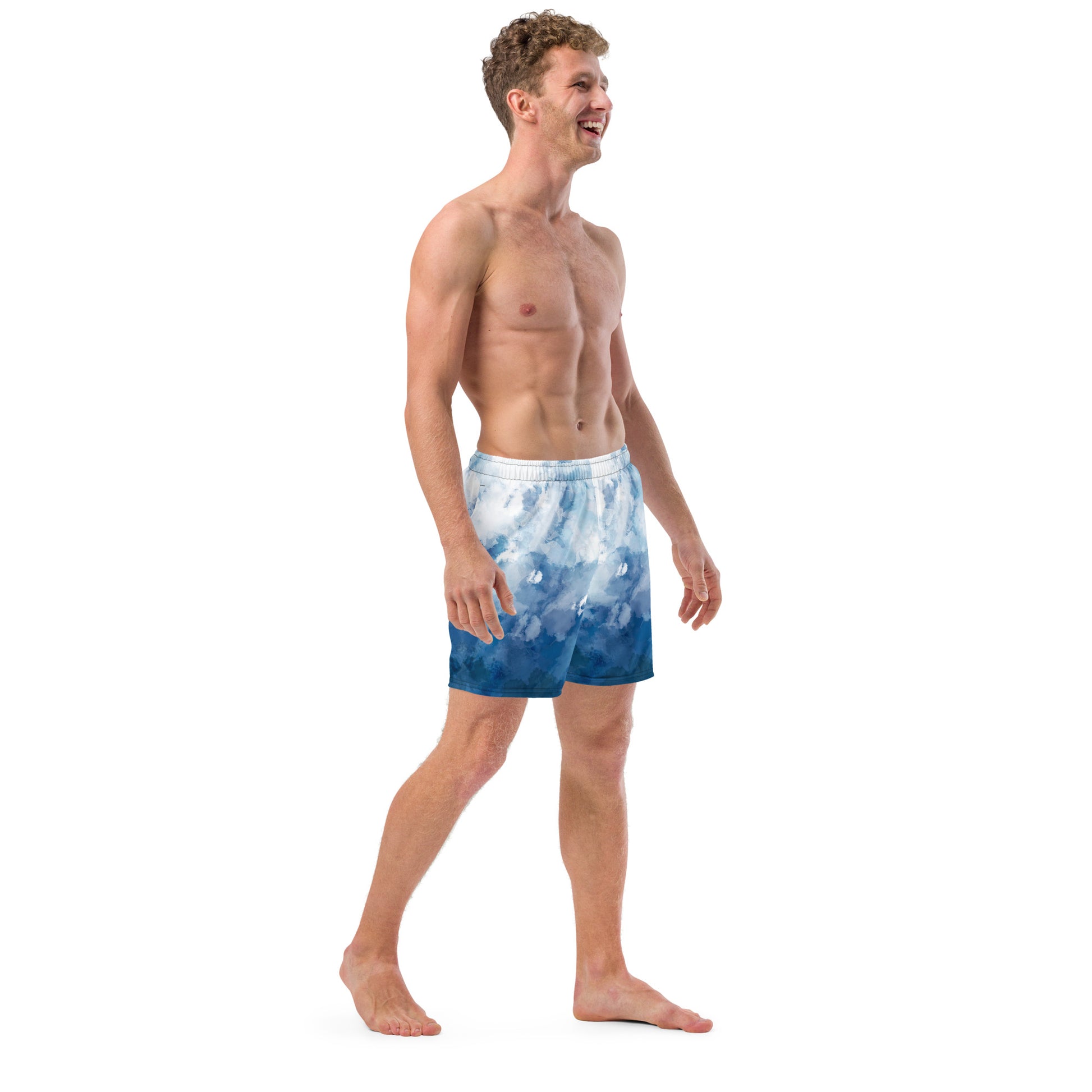 Man wearing swim trunks with a blue-white watercolor pattern.