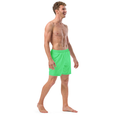 Man wearing mint-green swim trunks.