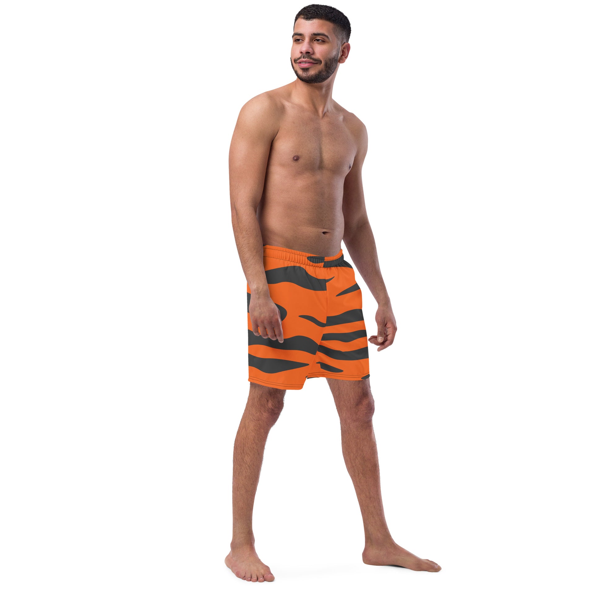 Man wearing swim trunks with tiger-skin pattern.