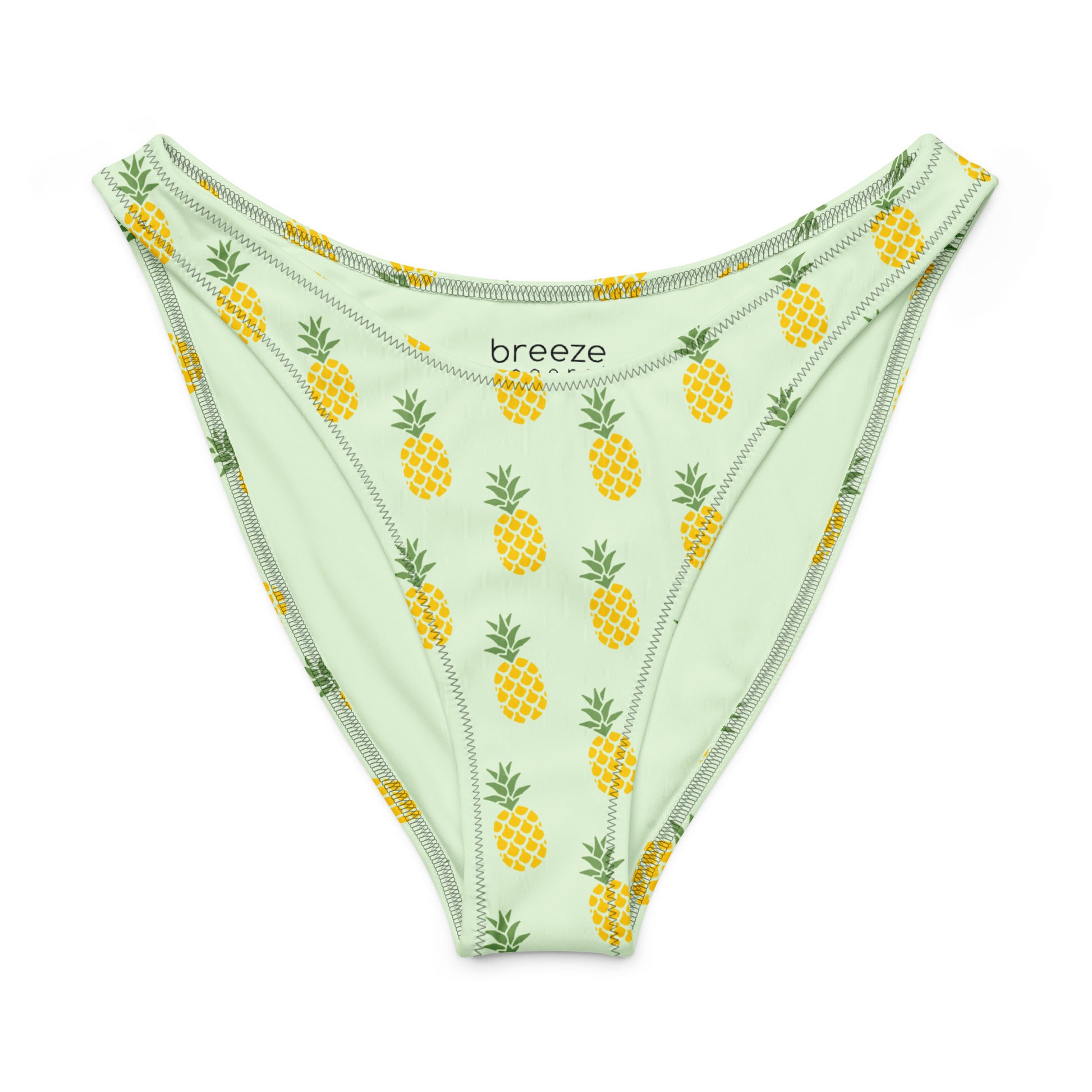 Bikini bottom with an all-over pineapple design set on a light-green background.