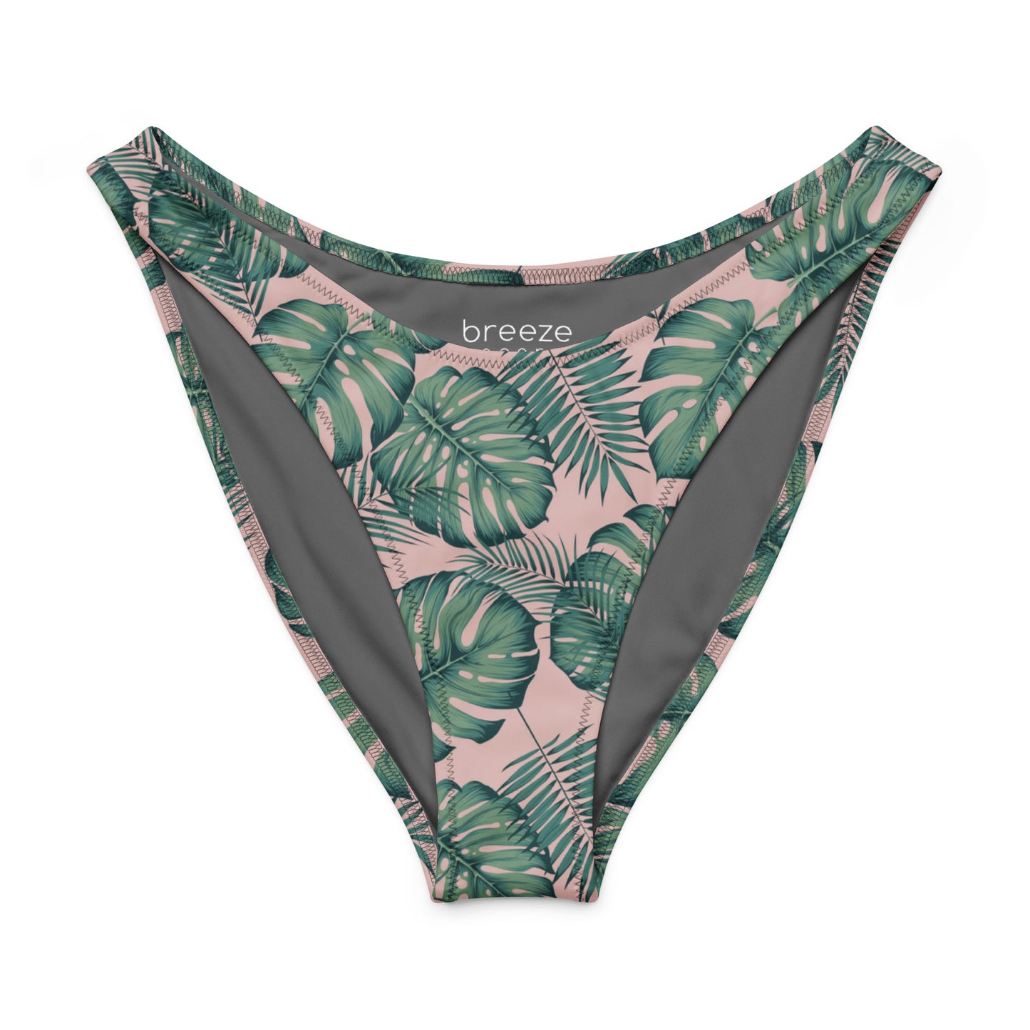 Bikini bottom with design of green palm leaves set on a pink background.