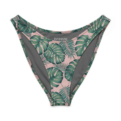 Bikini bottom with design of green palm leaves set on a pink background.
