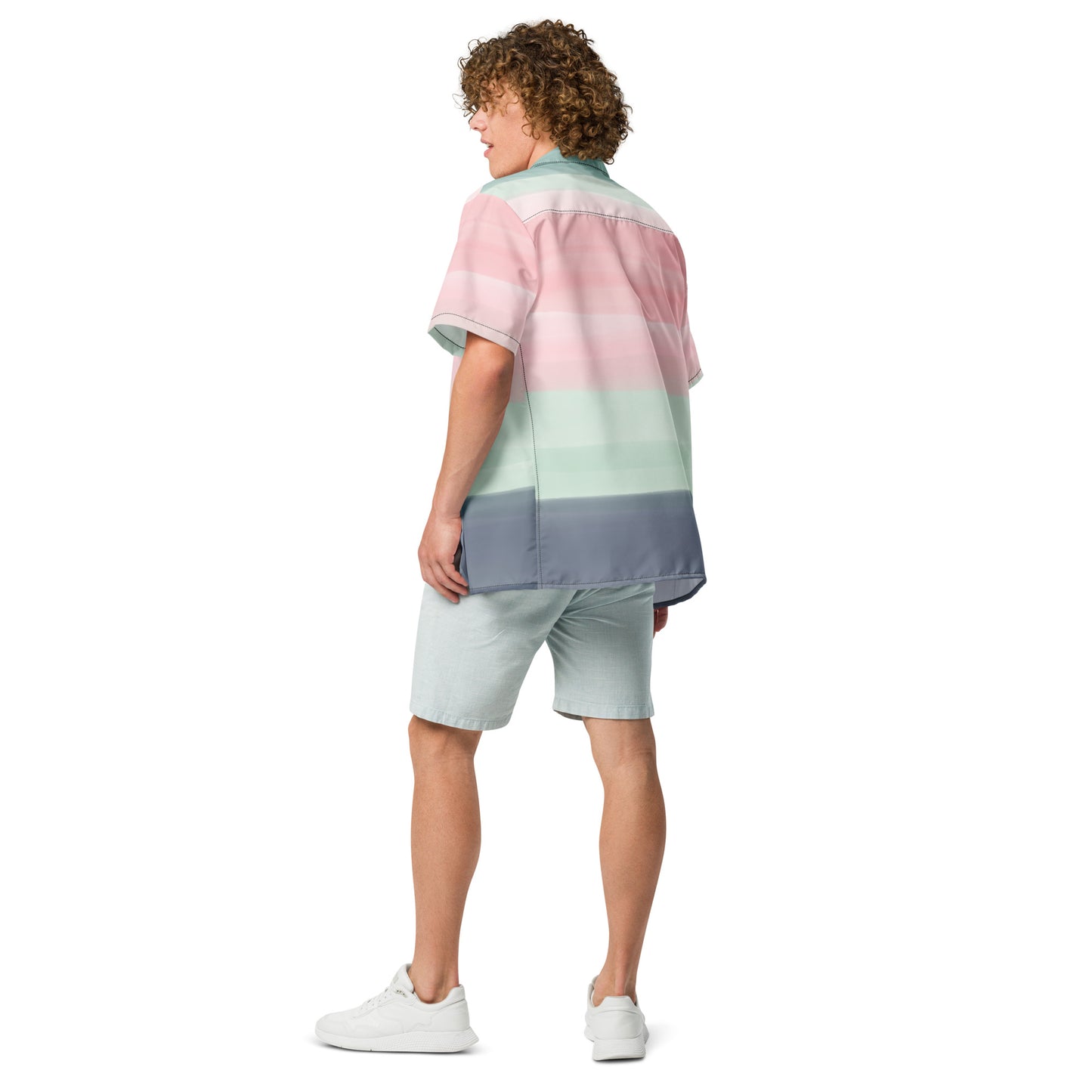 Rear view of man wearing button-down shirt with pattern of horizontal stripes that are a shade of pink, mint green, or gray, resembling a watercolor design.