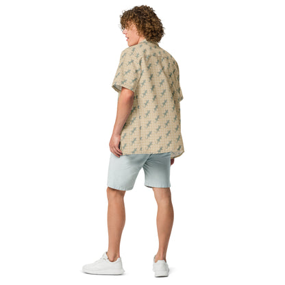 Man wearing beige button-down shirt with pattern of green geckos.