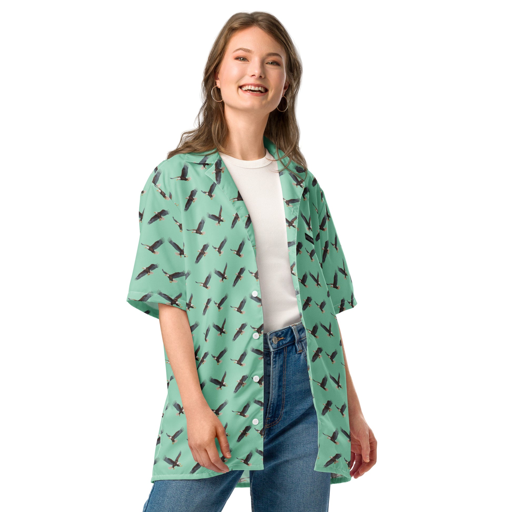 Woman wearing green button-down shirt with pattern of bald eagles.