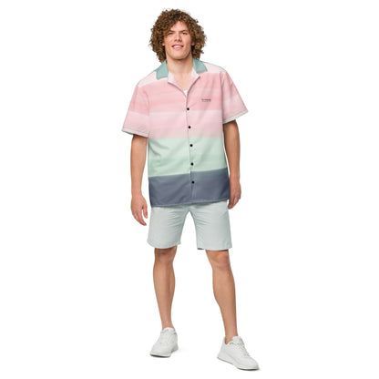 Man wearing button-down shirt with pattern of horizontal stripes that are a shade of pink, mint green, or gray, resembling a watercolor design.