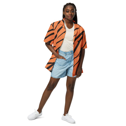 Woman wearing button-down shirt with tigerskin pattern.
