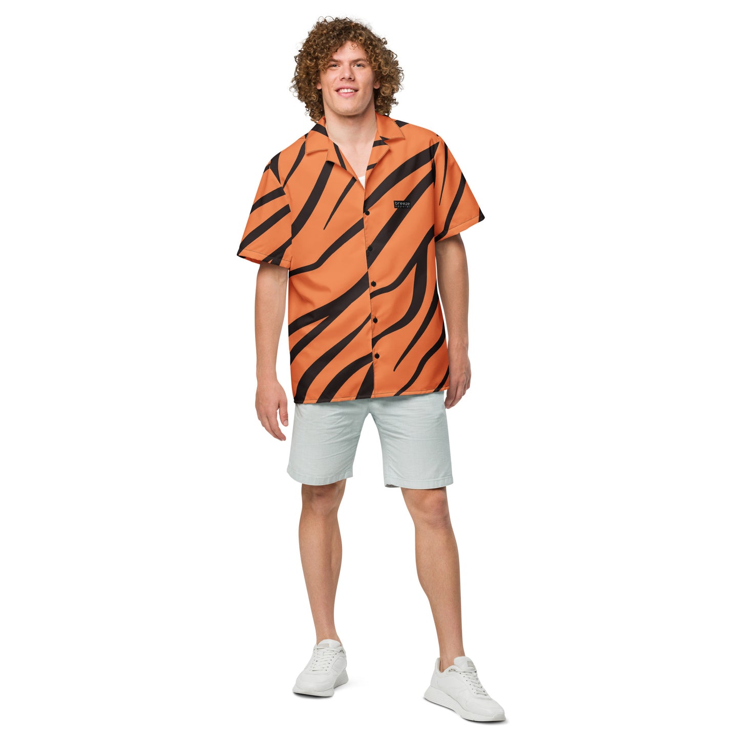 Man wearing button-down shirt with tigerskin pattern.