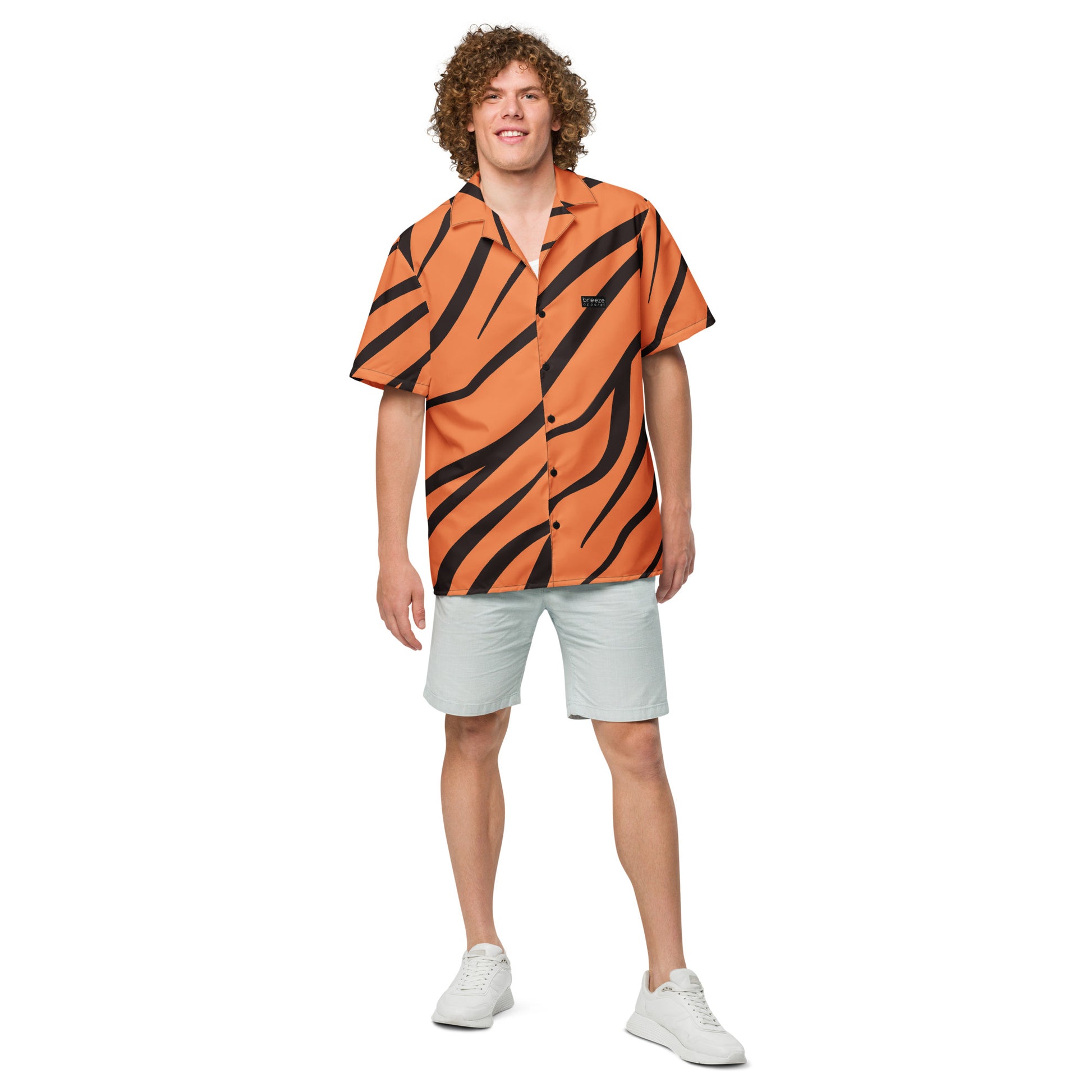 Man wearing button-down shirt with tigerskin pattern.
