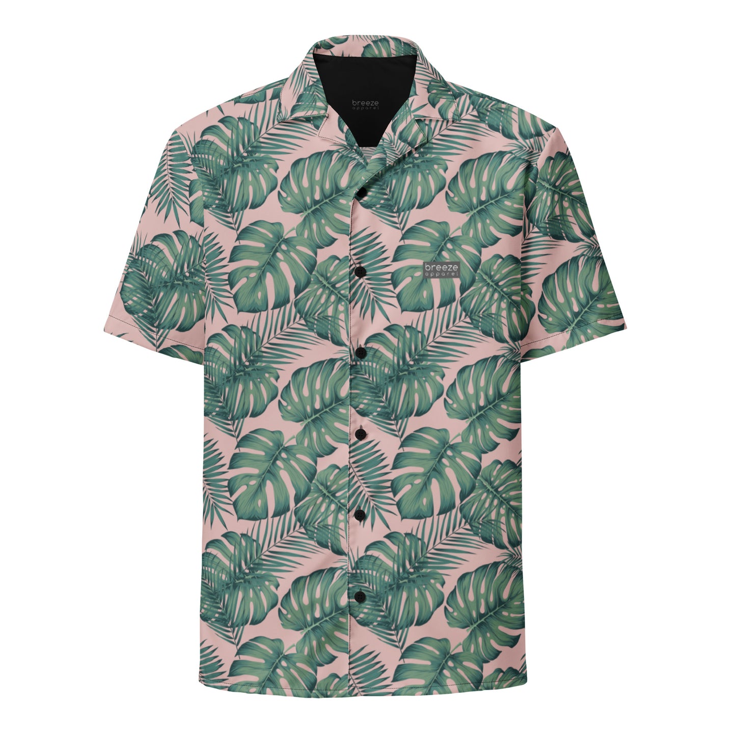 Button-down shirt with pattern of green palm leaves set on a pink background.